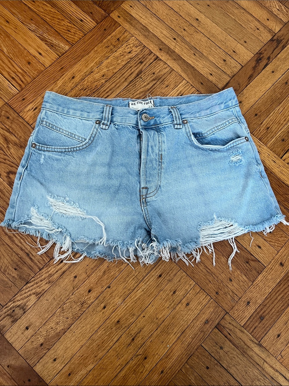 We The Free Light Wash Distressed Denim Cutoff Shorts size 28